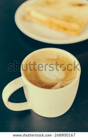 Coffee cup in coffee shop cafe - vintage effect style pictures