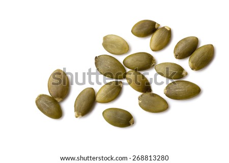 Pumpkin seeds or pepitas, isolated on white background.  Overhead view. Royalty-Free Stock Photo #268813280