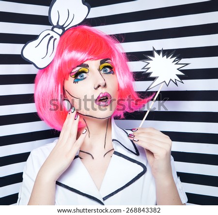 Photo of surprised young woman with talk bubble and professional comic pop art make up and accessories