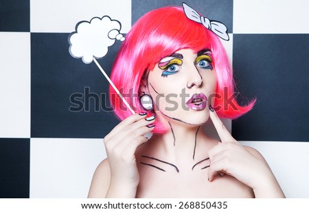 Photo of surprised young woman with talk bubble and professional comic pop art make up and accessories