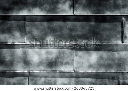 dark grungy metal surface of a wall as a texture background