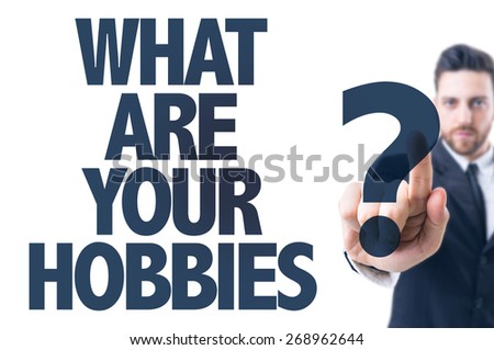Business man pointing the text: What Are Your Hobbies?
