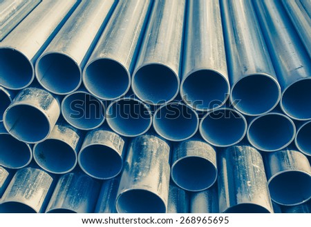 Close - up Stack of construction metal pipes 
