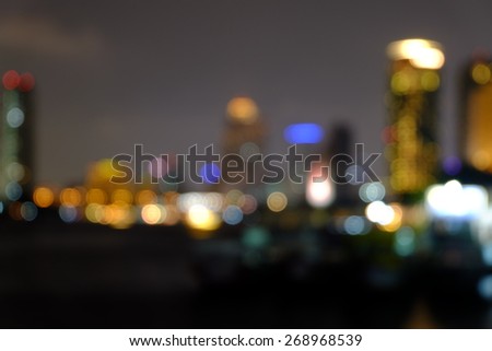 light  bokeh blurred abstract background of bangkok cityscape and Chao Phraya River view at night
