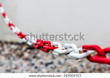 a red and white metal chain - do not enter
