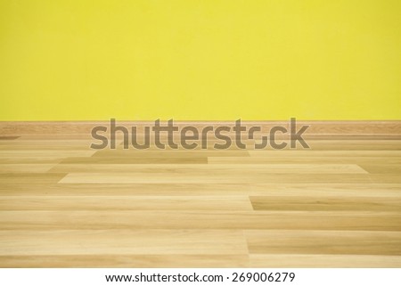 Empty room with green wall and wooden floor