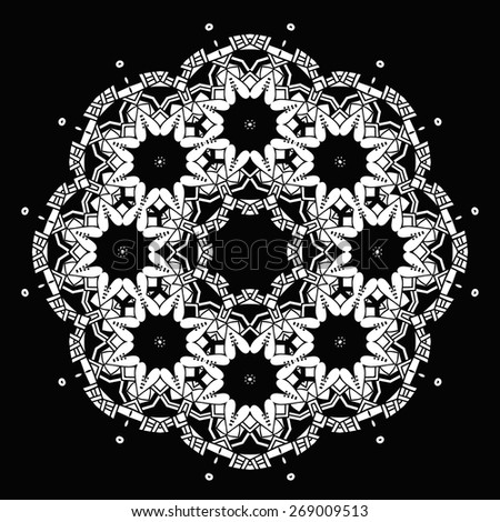 White round ornament on black background. Ethnic mandala. Vector art