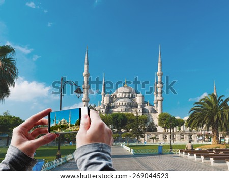 Tourist taking a picture of The Blue Mosque, (Sultanahmet Camii), Istanbul, Turkey 