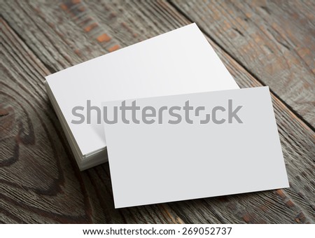 Business cards on wood table ( with separate layer clipping path : Card upper,Card lower )
