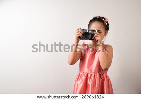 asian kids holding camera