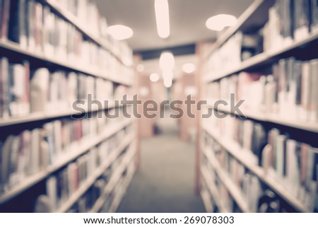 Blurred books in public library. Blur effect. Background.