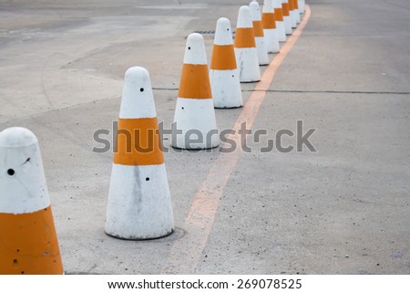 Line of traffic cones to prevent a driver not to drive off the safety zone.