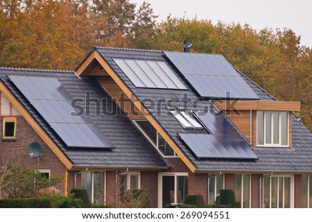 Photovoltaic Solar Panels on Newly Built Modern House Royalty-Free Stock Photo #269094551