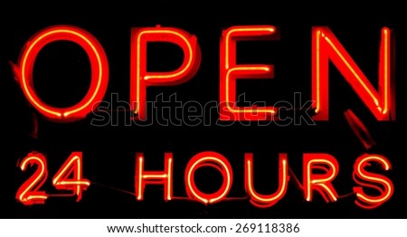 Open 24 Hours neon sign on black background