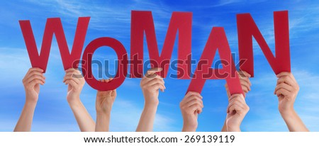 Many Caucasian People And Hands Holding Red Letters Or Characters Building The English Word Woman On Blue Sky