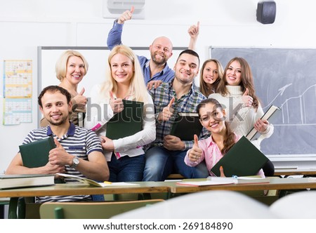 Happy cheerful students and coach posing at training session school. Selective focus Royalty-Free Stock Photo #269184890