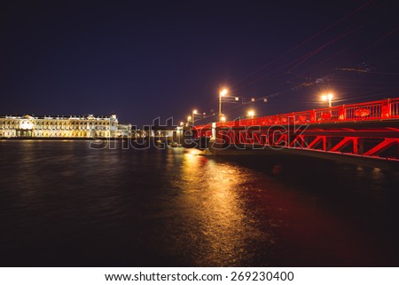 Beautiful night panoramic picture of Saint-Petersburg, Russia, with most famous Palace Bridge with beautiful illumination, palace embankment, with Saint Isaac's Cathedral and Neva river 