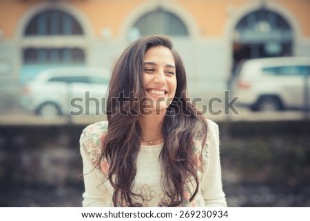 young beautiful brunette woman in the city