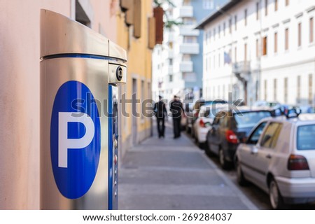 Machine parking on a city street Royalty-Free Stock Photo #269284037