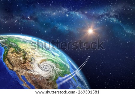 Leaving Earth. Very high definition picture of planet earth in outer space. Spacecrafts lifting off from USA soil, hit by a cyclone. Elements of this image furnished by NASA