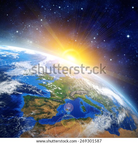 Sunrise over the Earth. High definition picture of planet earth in outer space with the rising sun. Elements of this image furnished by NASA