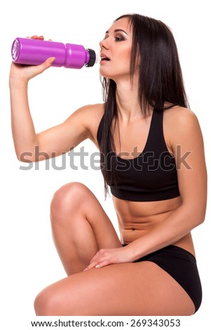 Fitness woman drinking water - Stock Image