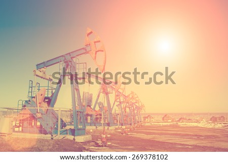 Oil pump on background of blue sky - instagram style