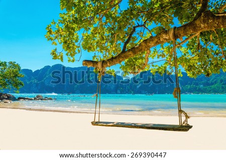 Swing hang from coconut tree over beach, Phi Phi Island, Thailand Royalty-Free Stock Photo #269390447
