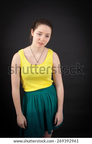 beautiful woman doing different expressions in different sets of clothes: tired