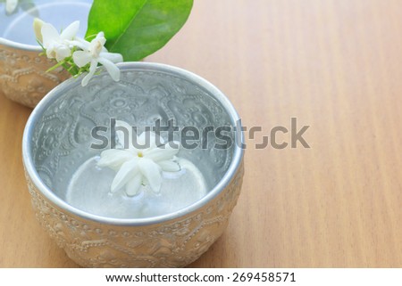 water and jasmine in water dipper