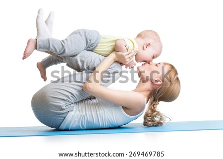 young mother does fitness exercises together with kid boy isolated