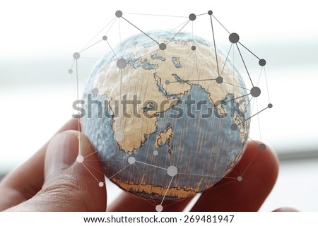 icon on wooden ball of website and internet contact us page concept on computer laptop keyboard and social media diagram