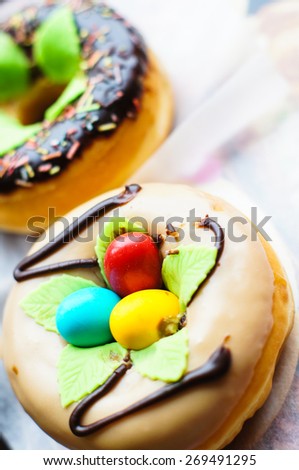 bright donuts on the wooden background