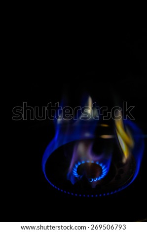 Blue and red gas stove in the dark