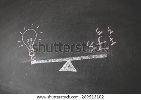 Financial concept designed with colored chalk on blackboard. This photo may use as financial background. Illustration is showing the balance between currency and idea and concept. 