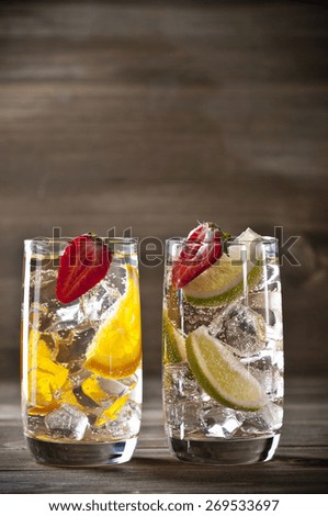 Three fruit cocktails on a wooden table