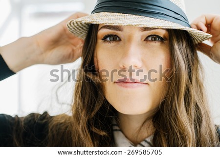 young girl with a hat
