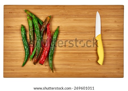 Hot pepper on wooden cutting board