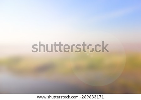 blurred nature background with flare light