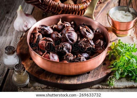 Closeup of roasted chestnuts  with parsley
