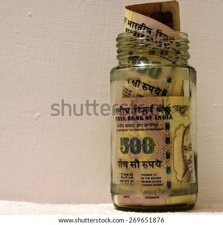 Indian money in glass jar with lot of space for text Royalty-Free Stock Photo #269651876