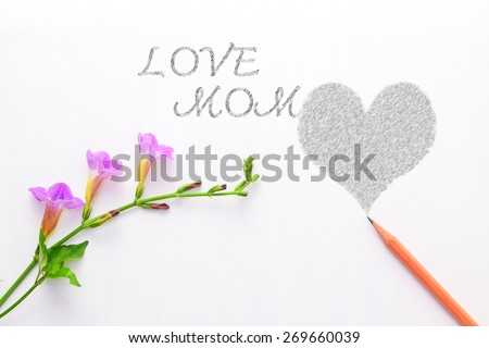 Flowers with pencil  on the white paper notes.whit love mom background for greetings for Mother's Day 