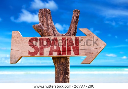 Spain wooden sign with beach background