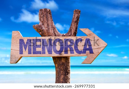 Menorca wooden sign with beach background