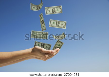 Woman's hands catching money