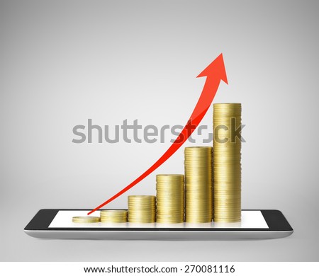 Tablet pc with business graph and golden coin 