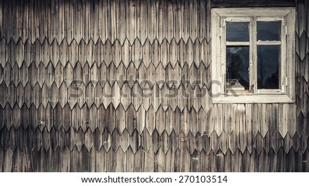 Wooden window on wooden wall