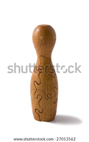 Wooden 3d puzzle in form of bowling pin. Isolatet on white. Clipping path included.
