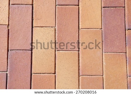 Brown ceramic tiles on street closeup 