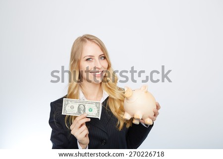 Businesswoman Holding Piggy Bank with an one dollar bill.